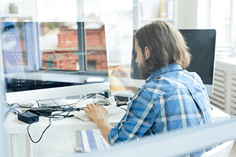 A man is prototyping on a computer