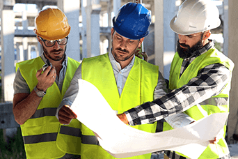 construction workers reading a plan