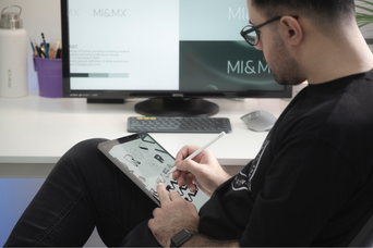 A man is prototyping on a computer